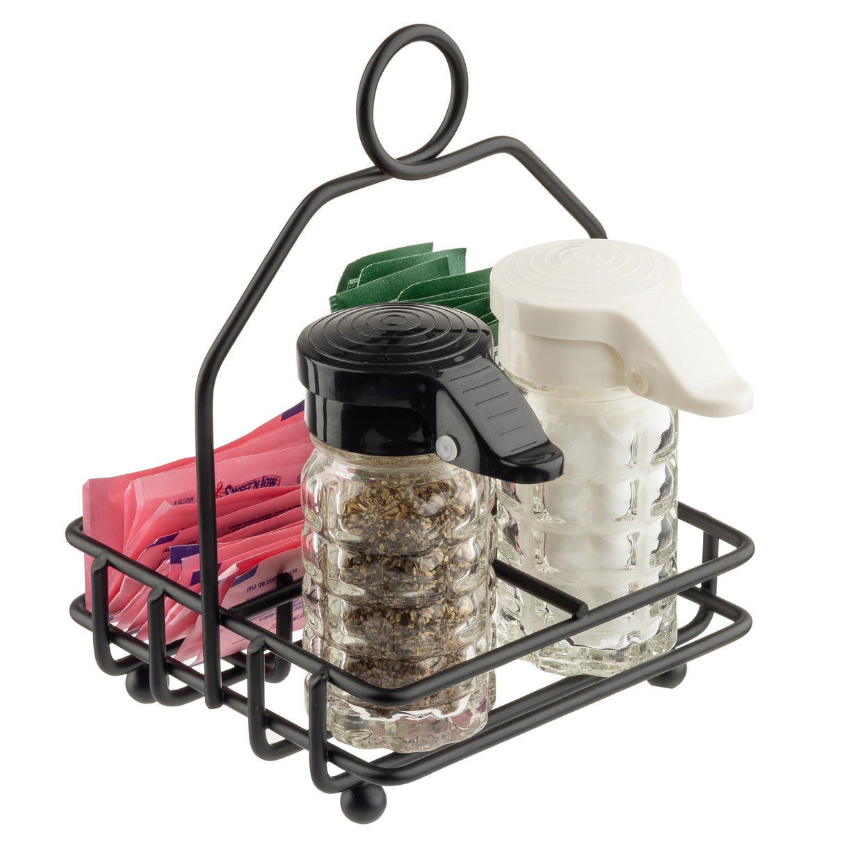 A black powder coated metal combination rack by TableCraft Products holds glass shakers with black and white lids, plus pink, blue, and green sweetener packets upright behind them. The caddy features a loop handle and ball feet.
