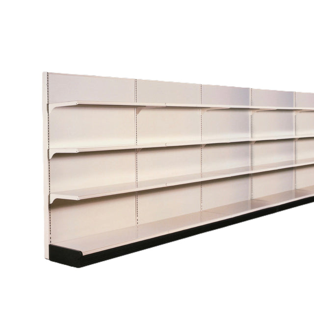 A long, empty retail wall unit with four horizontal metal shelves in beige and a solid black base stands against an ivory wall storage area. The image, taken at an angle, offers depth and perspective.