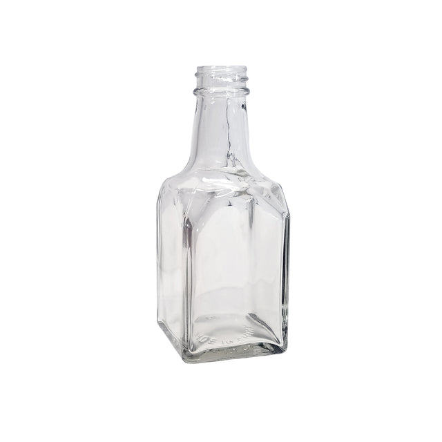 A clear, empty 6 oz. glass bottle with a square base, flat sides, and a short, narrow neck with threading for a cap. This dishwasher safe replacement jar stands upright on a white background.