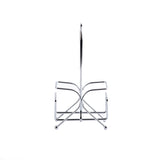 A TableCraft chrome plated napkin rack featuring a curved, symmetrical design on both sides, resting on four small spherical feet, all set against a plain white background. The holder is empty and viewed from the front with its central handle upright.