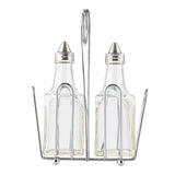 Two glass bottles with stainless steel tops sit side by side in a silver metal wire holder with a central handle, designed for easy carrying. This Oil & Vinegar Dispenser keeps the bottles upright and secure while adding simple charm to your table.