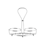 A chrome plated TableCraft Oil & Vinegar Dispenser Rack, featuring a central handle and two circular compartments to hold jars or glasses. Its simple, open structure has a polished finish and stable base, set against a plain white background.