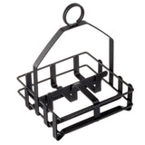 A black powder coated metal wire basket with a square base, perfect as a condiment rack or for salt and pepper shakers. It features four sections, open sides, and a central handle with a circular loop for easy carrying.