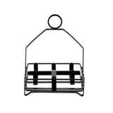 A black powder coated metal wire egg holder with a rectangular base, divided into six circular sections for holding eggs. Features a looped handle for easy carrying. The minimal design suits any kitchen or can double as a condiment rack. Background is white.