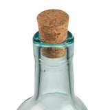 A close-up of the neck of a TableCraft Olive Oil Bottle sealed with a light brown, textured cork stopper. The green tinted glass has a smooth finish, and the background is plain white.