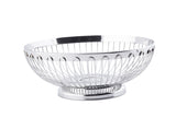 A shiny, round stainless steel basket with an open design and solid circular base. The Regent Basket features evenly spaced vertical wires and a smooth, reflective rim for a modern, minimalist look. The background is plain white.