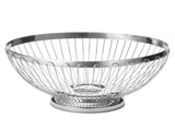 A round, shallow TableCraft Regent Basket made of shiny stainless steel, featuring vertical bars and an open design with a circular base. The plain white background highlights the basket's reflective metallic surface and modern, minimalist style.