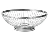 A round, silver stainless steel basket with an open design, wide rim, and sturdy circular base. The evenly spaced vertical wires curve outward for an airy, modern look. This TableCraft 6174 Regent Basket is set against a plain white background.