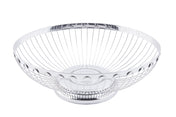 A round, empty Regent Basket with an open design. The smooth circular base and flared sides are made of evenly spaced vertical wires, featuring a shiny, polished silver finish. This TableCraft stainless steel basket sits on a flat, white background.