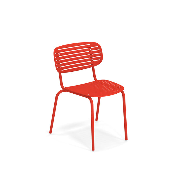 A modern red solid steel chair with a slatted seat and backrest, featuring four straight legs. This stacking side chair has a minimalist design and is photographed against a plain white background.