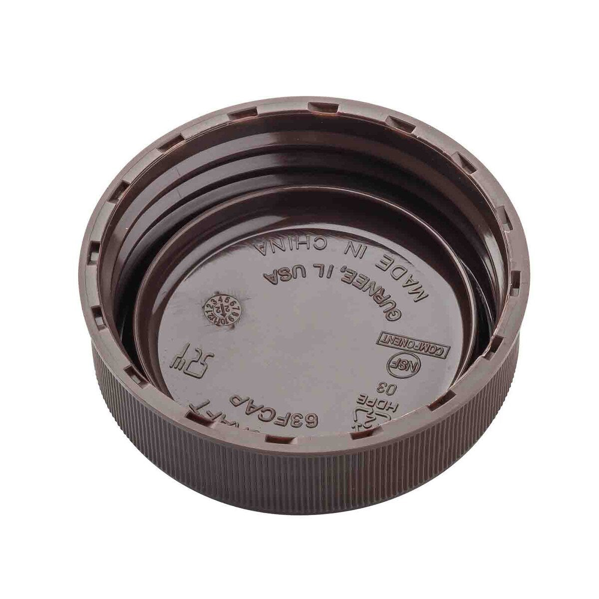 A close-up of a brown squeeze bottle end cap, shown with the inside facing up. The 63mm cap has raised ridges on the edge and embossed text and symbols inside, including recycling info, MADE IN CHINA, NSF mark, and manufacturing details.