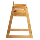 A wooden high chair viewed from the side, showing its triangular frame with horizontal support bars and a brown safety strap. The smooth, light-colored wood features visible grain and black screws. This stackable design is ASTM F404-18 compliant.