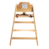A stackable wooden high chair with a safety harness is shown from the front. The chair has a natural wood finish and features an ASTM F404-18 compliant warning label with safety instructions on the upper backrest, against a white background.