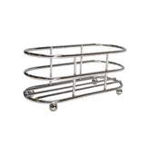 A shiny, chrome plated toast rack with an oval shape and open bars, designed to hold slices of toast upright. This TableCraft rack only stands on four small round feet and features a simple, modern design against a plain white background.
