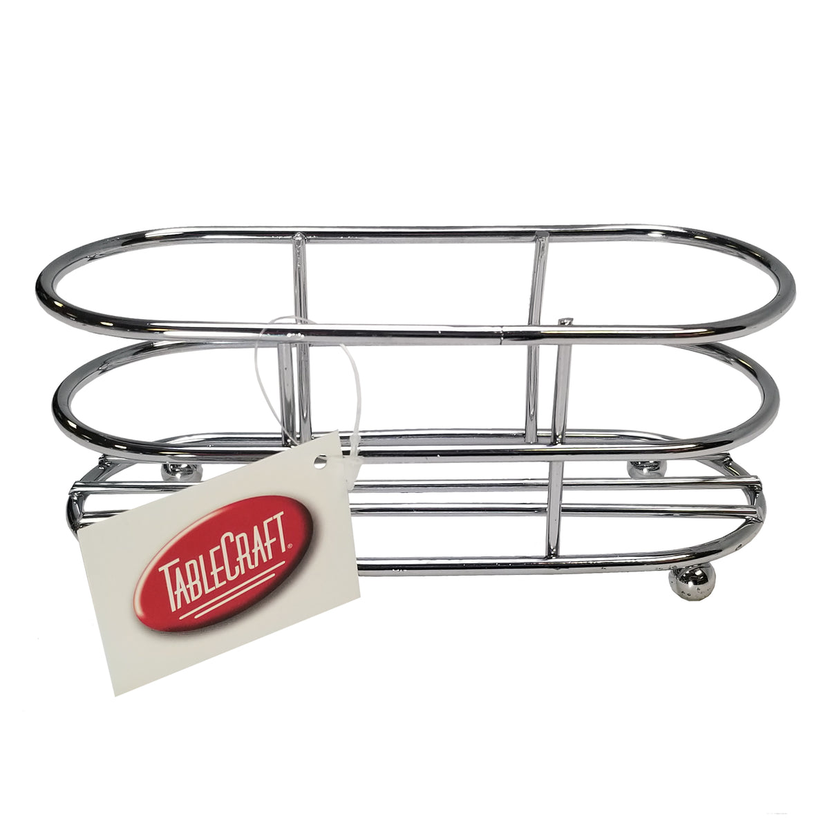 A shiny, chrome plated metal condiment caddy with an oval shape, open sides, and four small ball feet. A white tag with a red TABLECRAFT logo is attached to the front. This is the rack only—TableCraft 657R. Plain white background.