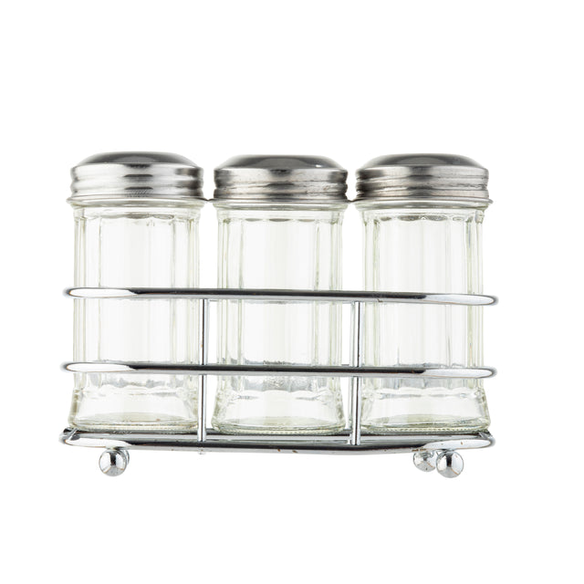Three empty glass shakers with stainless steel tops are arranged side by side in a silver metal rack. The jars have a classic, clear design, and the simple wire rack rests on small round feet. The background is white and uncluttered.