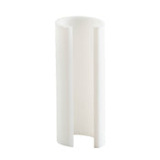 A white, cylindrical plastic object with a vertical slit forms an open, C-shaped profile. Designed as a pump restrictor for TableCraft dispensers, this smooth and slightly reflective piece is made to fit 3/4 oz pumps. Shown upright against a plain white background.