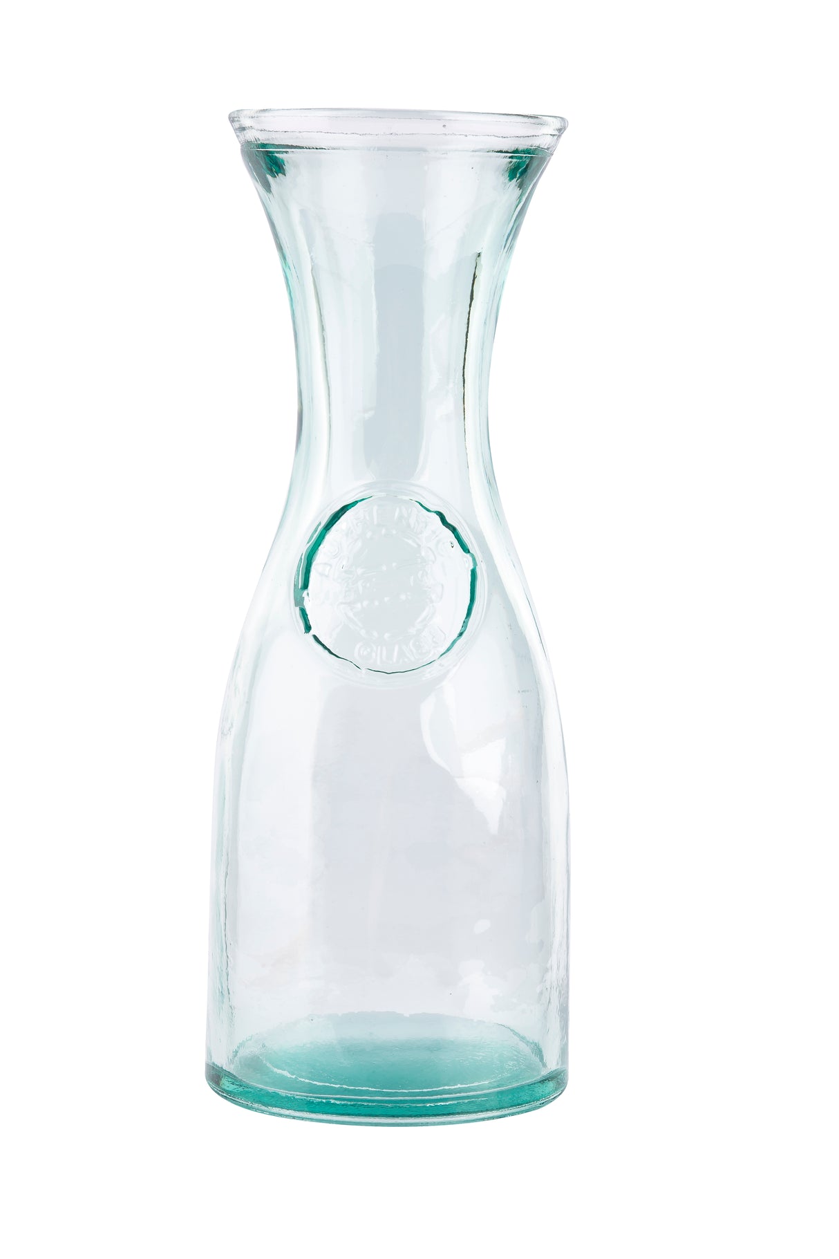 A tall, clear authentic carafe with a narrow neck and wide mouth. Crafted from recycled glass with a subtle green tint, it holds 28 oz. The slightly thicker bottom and embossed circular seal add elegance against a plain white background.