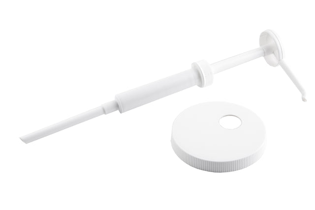 A white plastic 1 oz. economy pump dispenser with a long nozzle lies next to a matching, dishwasher safe screw-on bottle cap with a hole in the center, both set against a plain white background.