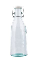 A clear 33 oz recycled glass bottle with a wide base tapers to a narrow neck, secured by a white re-sealable stopper with a metal clasp. The empty bottle stands upright against a plain white background.