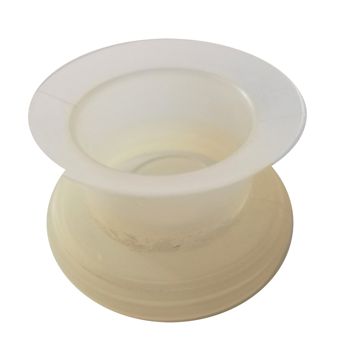 A translucent, plastic spool viewed from above on a white background. The empty spool, by TableCraft Products, features a wide rim, hollow center, and slightly wider base with subtle smudges or dust visible on its surface. Model: 663.
