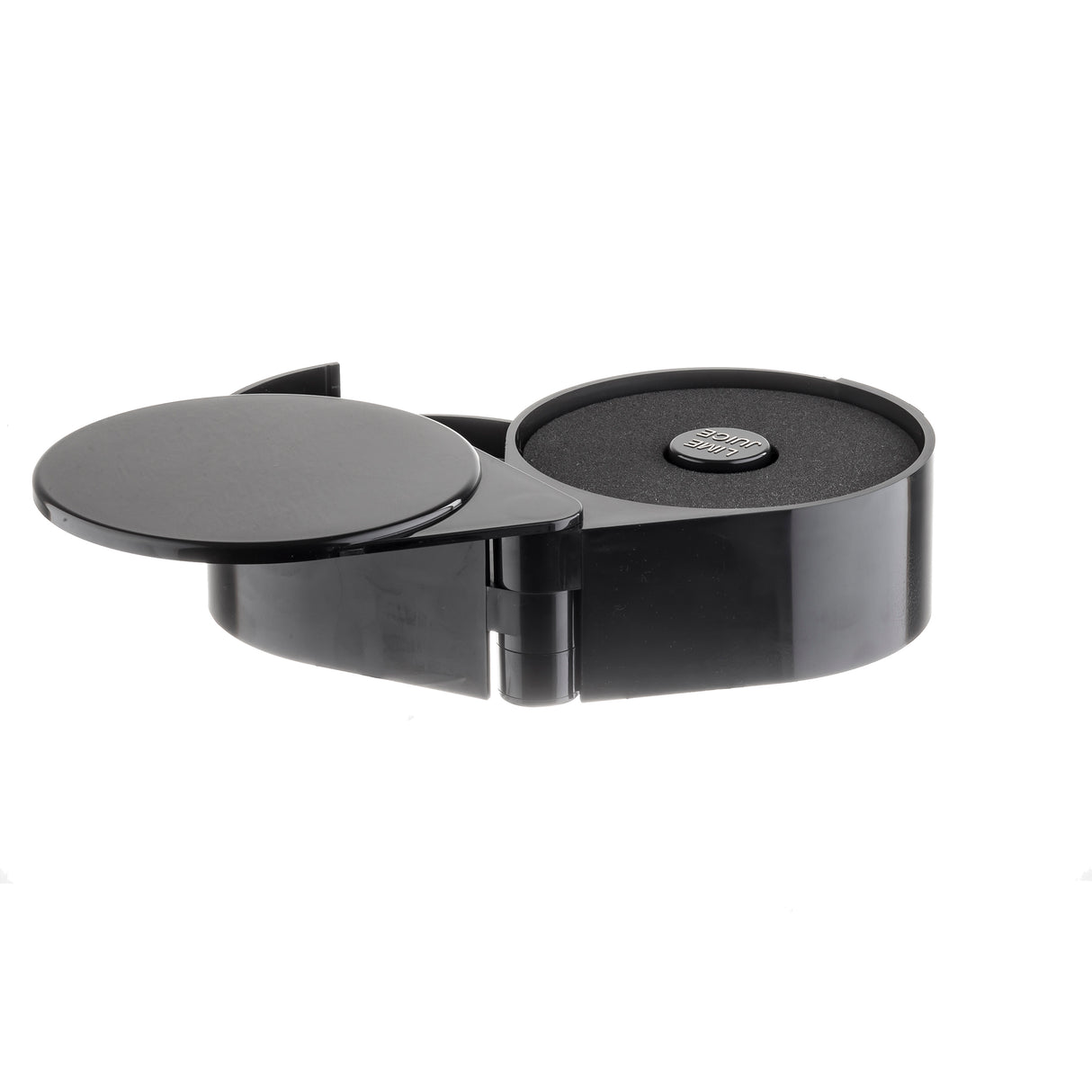 A black, round plastic container with a rotating flip-top lid is open, revealing a foam-lined interior. At the center sits a rimmer or coin-like object. The background is completely white.