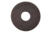 A dark gray, circular foam pad with a coarse texture, photographed on a white background. This replacement sponge features a large central hole, resembling a donut or ring shape. The lighting highlights its porous surface details.
