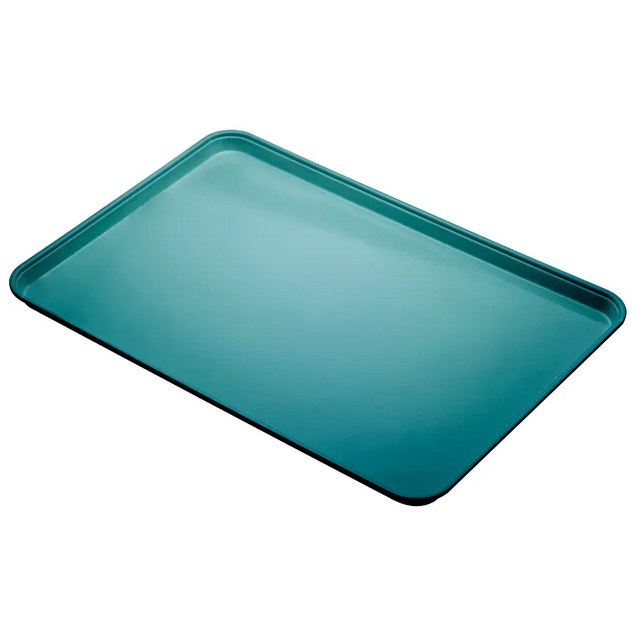A rectangular, teal-colored Camlite Tray with slightly raised edges is shown at an angle against a white background. The smooth, dishwasher safe surface and rounded corners highlight its design for baking or roasting.