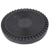 A round, black rubber drip tray with a textured surface. The center has concentric circular ridges, and the outer edge is fluted with angled grooves. Thick and sturdy, it's likely used as a protective or anti-slip pitcher drip tray for equipment or vehicles.