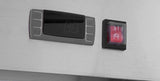 A digital control panel with a dark display and four buttons is mounted on metal. To its right is a red square switch with two white lines and a lock icon, indicating power and lock functions. The design is minimal, emphasizing function and clarity—hallmarks of the Atosa MBB69GGR Glass Door Refrigerator Back Bar Cooler.