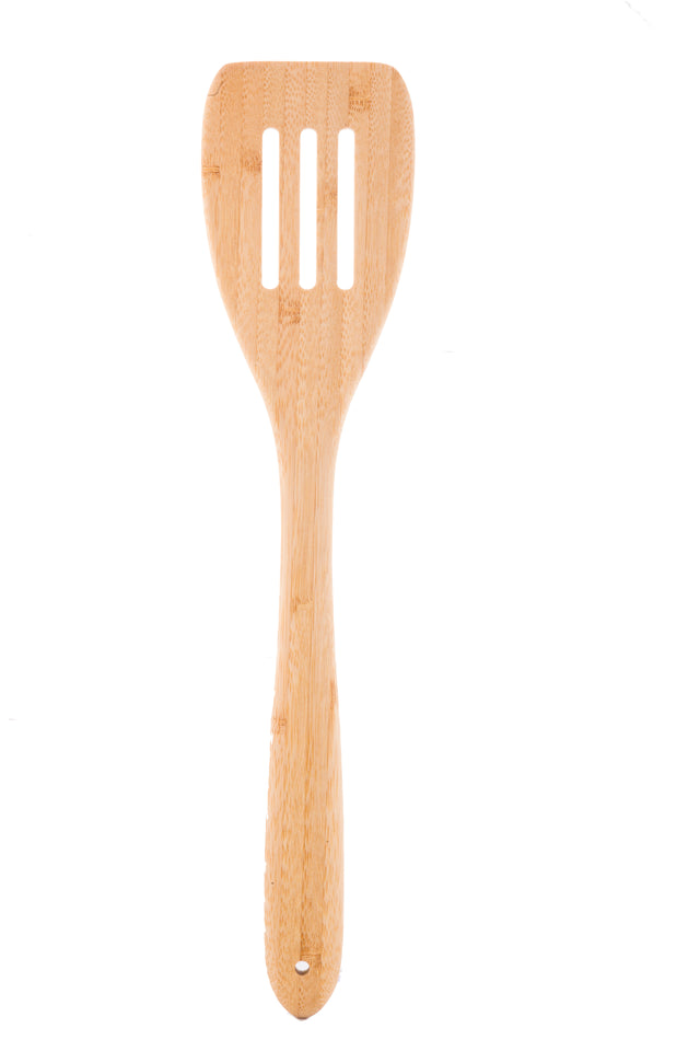A slotted bamboo turner with a smooth, light wood finish. The handle is rounded and tapers toward the rectangular head, which features three wide vertical slots. This TableCraft spatula is positioned vertically on a white background.