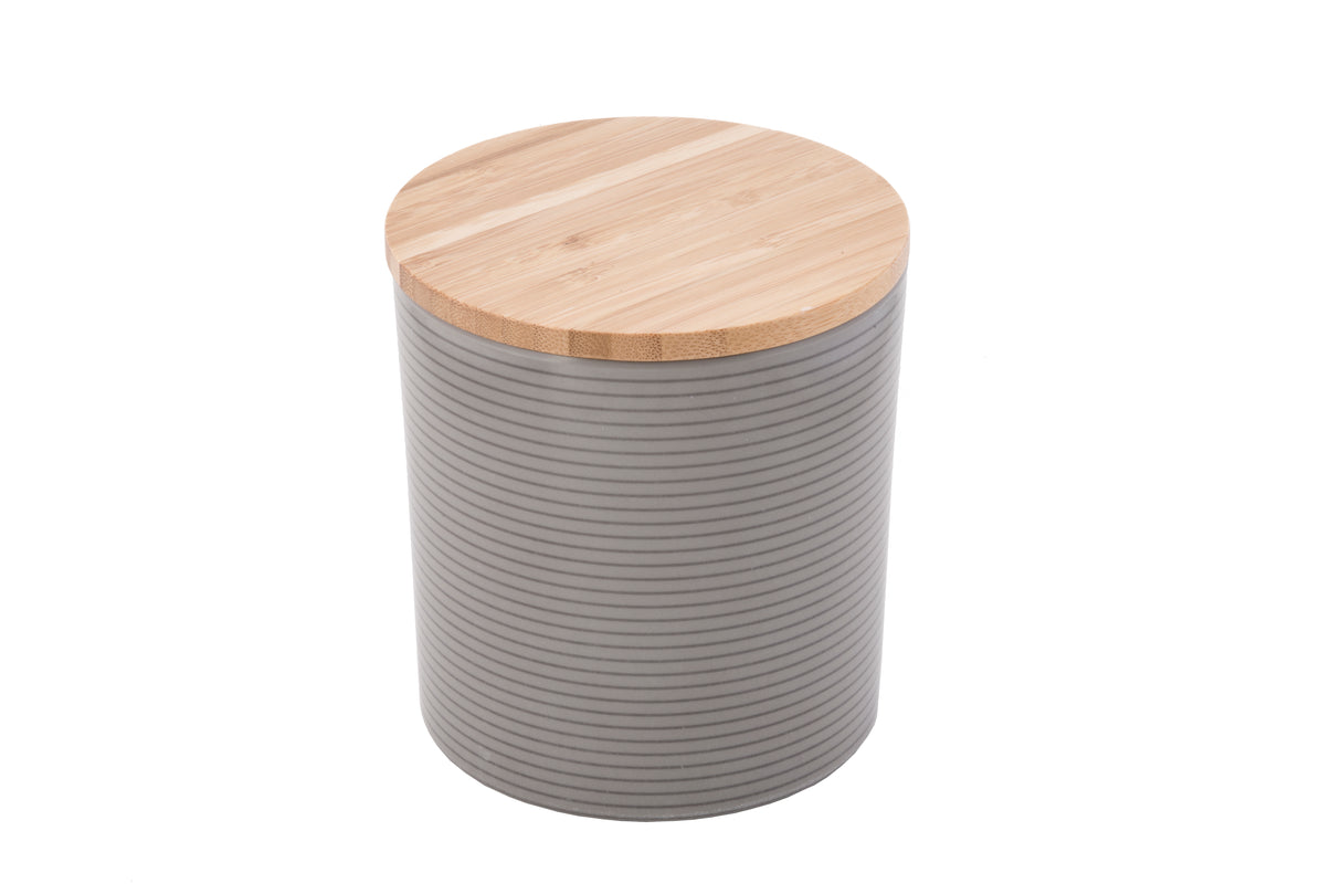 A cylindrical canister with a matte gray body featuring horizontal ridges and a flat, round bamboo lid with visible wood grain. The lid contrasts with the smooth, patterned surface, giving this canister a modern, minimalist look.