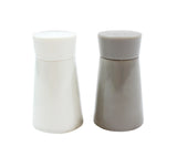 Two ceramic shakers stand side by side on a white background. This elegant Salt & Pepper Shaker Set features smooth, slightly tapered cylindrical shapes with small holes on top—the left is white, and the right is light gray.