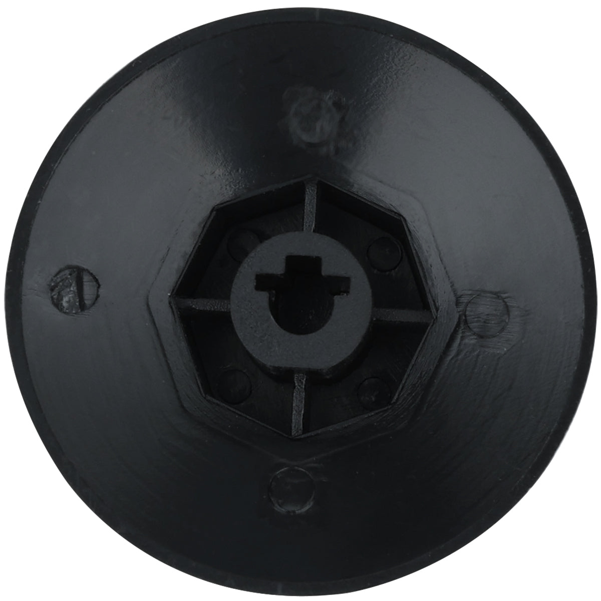 A close-up of an Empura Equipment knob, a black, circular plastic object featuring a central hexagonal indentation and a smaller circular hole at the center, with three evenly spaced screw holes along the matte surface.