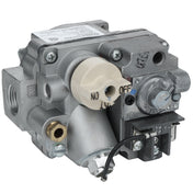 A close-up of a metallic gas control valve (Valve(NAT)) with labeled dials, connectors, and wiring terminals. A beige Empura Equipment control knob labeled OFF and ON is visible, along with several ports and engraved labels on a textured metal surface.