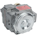 A close-up view of a metallic Valve(LP) from Empura Parts, featuring a round, silver front plate with several bolts. Threaded side openings allow pipe connections. The slightly worn surface shows signs of industrial use and Empura Equipment reliability.
