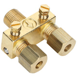 A brass refrigeration access valve from Empura Equipment with two hexagonal caps, two flathead screw valves, and an arrow indicating flow direction. The pilot valve features threaded connections and a polished metallic finish for HVAC or refrigeration lines.