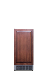 A front-facing view of an ADA compliant undercounter ice maker with a wooden cabinet door and a vented stainless steel panel at the bottom, set against a plain white background.
