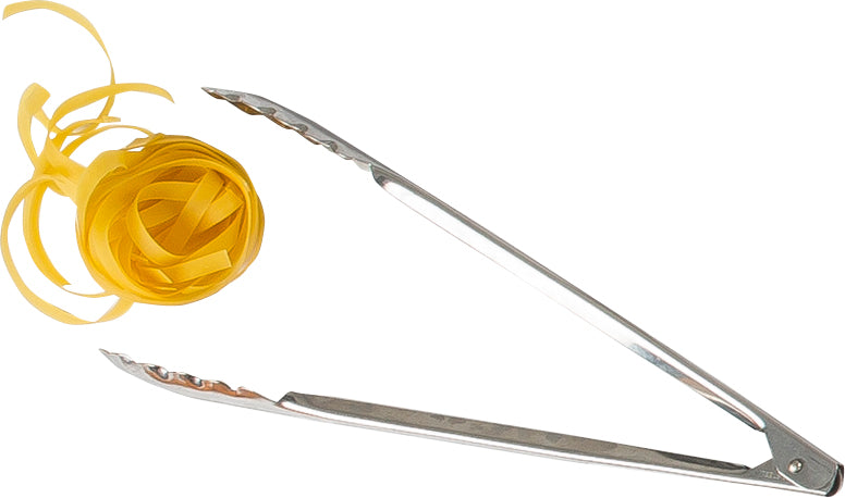 A bundle of uncooked fettuccine pasta is held by the gripping ends of stainless steel tongs, set against a plain white background. The utility tongs are angled diagonally, with the pasta on the left side.