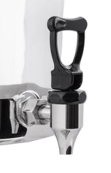 Close-up of a black plastic and silver metal spigot attached to a shiny stainless steel 2 gallon beverage dispenser. The handle is upright, and the white background highlights the spout’s details and reflections.