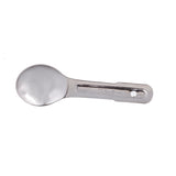 A shiny, stainless steel measuring spoon with a round bowl and a flat handle featuring engraved 1 tsp measurement markings and a small hole at the end, positioned on a white background.
