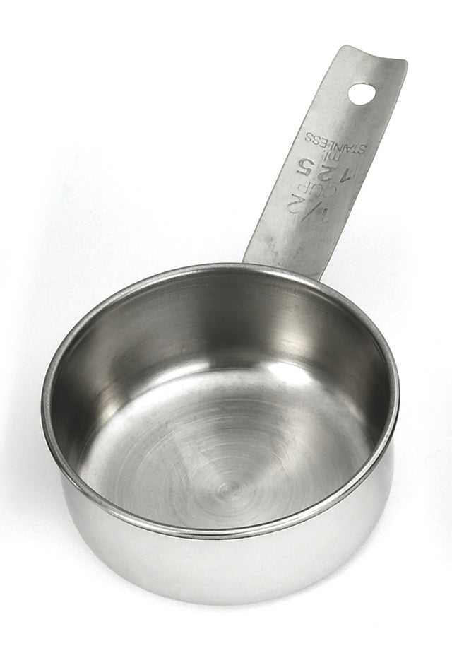 A stainless steel measuring cup with a flat handle is shown. The handle, marked “1/2 CUP, 125 mL, STAINLESS,” highlights its dishwasher safe design. The clean, empty cup is displayed from overhead on a plain white background.