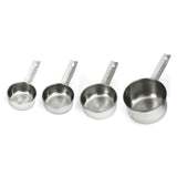 Four stainless steel measuring cups of different sizes are arranged in a row from smallest to largest. Each dishwasher safe cup has a flat handle with a hole at the end, and engraved measurement markings, set against a white background.