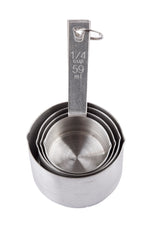 Four stainless steel measuring cups are nested together on a white background. The top cup is labeled 1/4 cup 59 ml on the handle. A metal ring holds the dishwasher safe set together through holes in each handle.