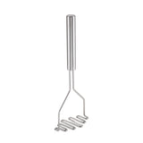 The TableCraft potato masher features a simple, modern design with a stainless steel handle and a zigzagged, flat mashing plate—perfect for effortlessly mashing potatoes or vegetables. The background is plain white.