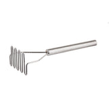 The TableCraft stainless steel potato masher features a long cylindrical handle and a zigzag mashing plate, ideal for crushing potatoes and other soft foods. Its shiny, metallic finish stands out against the white background.