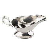 A shiny stainless steel gravy boat with a curved spout, wide bowl, and sturdy oval base. The arched handle is attached at the back. The reflective surface shows some light distortion. This vessel is empty and photographed on a white background.