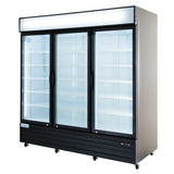 A large glass door cooler with three clear doors and black frames, showcasing empty white shelves inside. The unit has wheels for mobility, a blank illuminated sign panel on top, and a sleek silver and black exterior—perfect for commercial refrigeration.