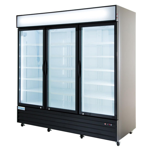 A large glass door cooler with three clear doors and black frames, showcasing empty white shelves inside. The unit has wheels for mobility, a blank illuminated sign panel on top, and a sleek silver and black exterior—perfect for commercial refrigeration.