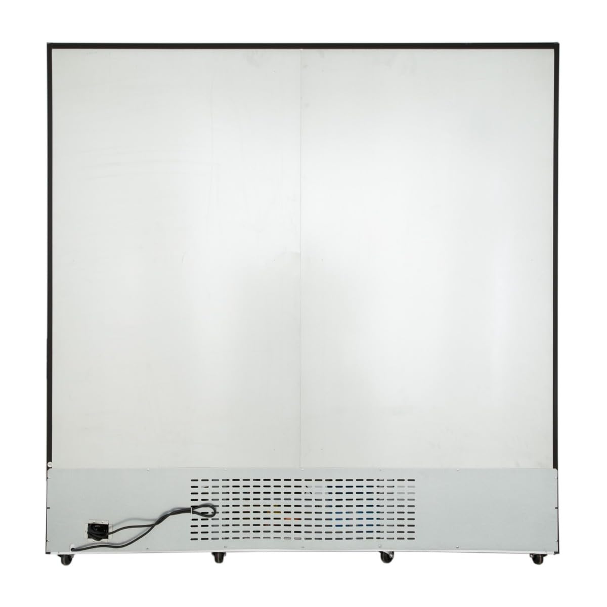 A large, rectangular white commercial refrigeration appliance features a metal panel with ventilation holes at the bottom. A black electrical cord is plugged into the lower left side, while the surface above remains plain and smooth.